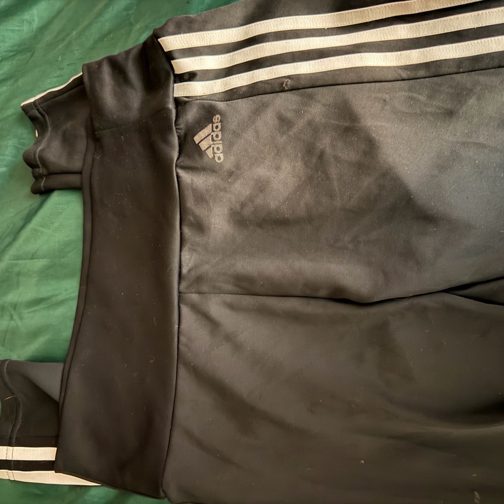 Adidas womans Black stretch pants with White Stripes